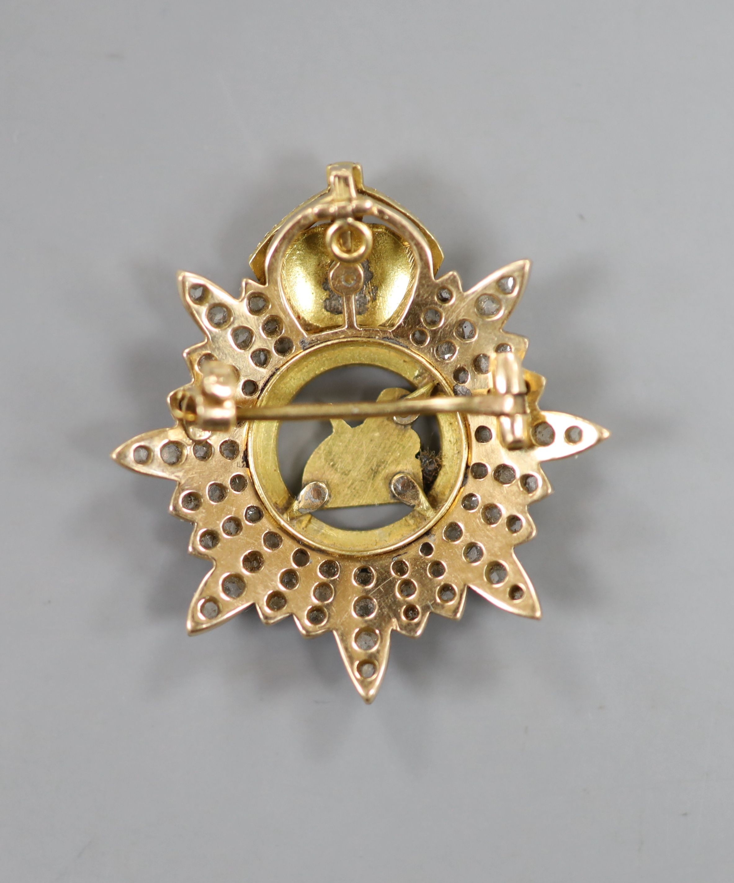 A late 19th/early 20th century yellow metal, enamel and rose cut diamond set 'The Manchester Regt. Egypt' pendant brooch, 32mm, gross weight 9.1 grams.